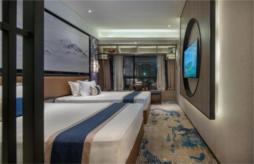 Imagen de la habitación del Hotel Yuan Culture Hotel Shenzhen World Shajing. Foto 9