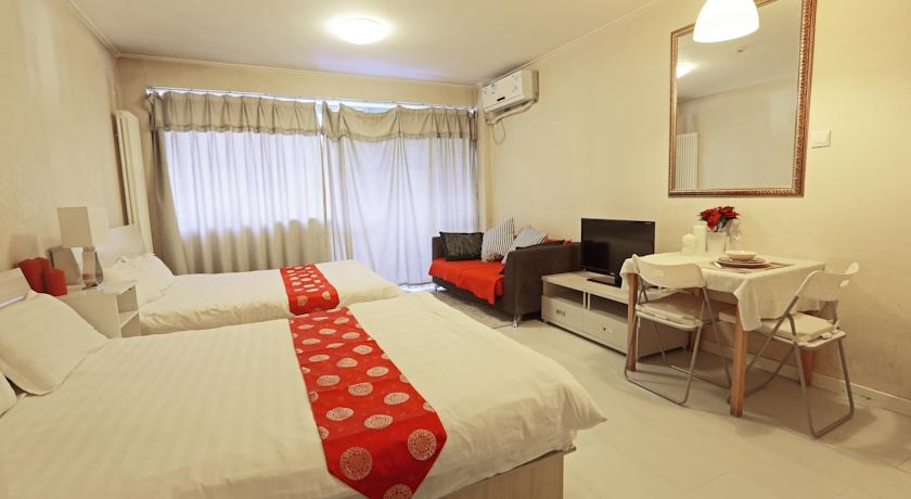 Imagen de la habitación del Hotel Yuan Jia International Apartment. Foto 2