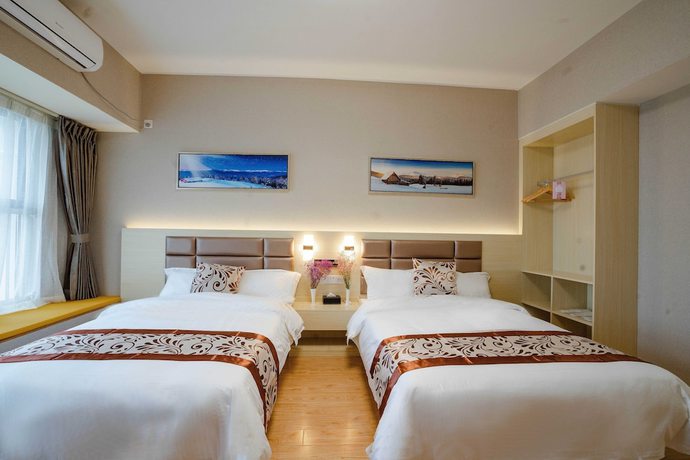 Imagen de la habitación del Hotel Yue Tu Apartment. Foto 3