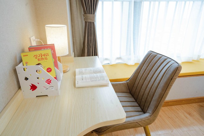 Imagen de la habitación del Hotel Yue Tu Apartment. Foto 4