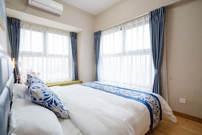 Imagen de la habitación del Hotel Yue Tu Apartment. Foto 5