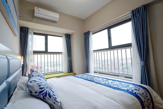Imagen de la habitación del Hotel Yue Tu Apartment. Foto 6