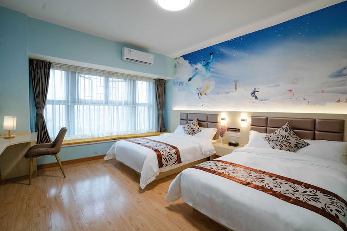 Imagen de la habitación del Hotel Yue Tu Apartment. Foto 7