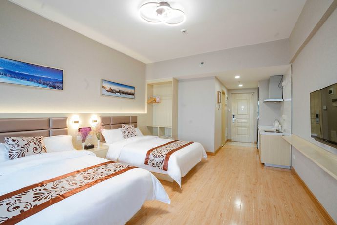 Imagen de la habitación del Hotel Yue Tu Apartment. Foto 8