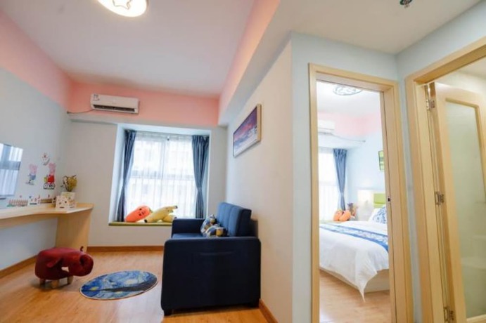 Imagen de la habitación del Hotel Yue Tu Apartment. Foto 9