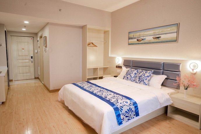 Imagen de la habitación del Hotel Yue Tu Apartment. Foto 10