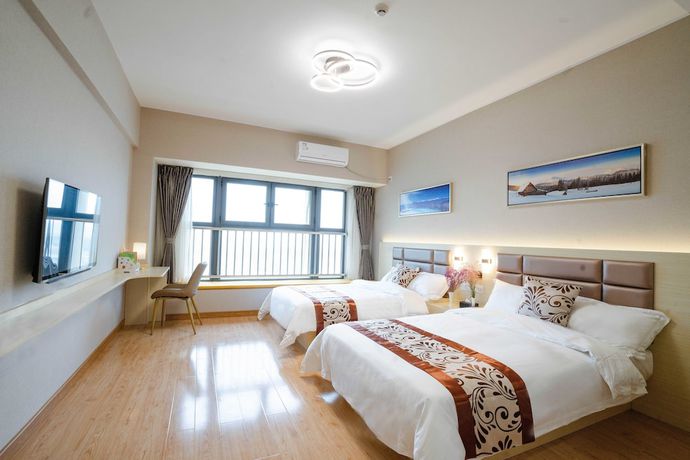 Imagen de la habitación del Hotel Yue Tu Apartment. Foto 11