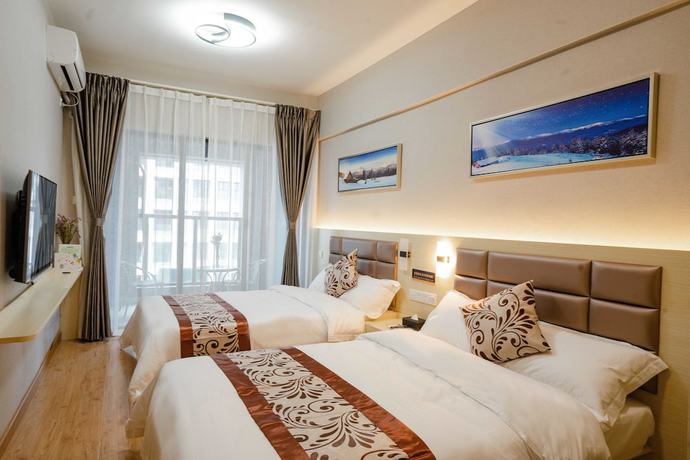 Imagen de la habitación del Hotel Yue Tu Apartment. Foto 12