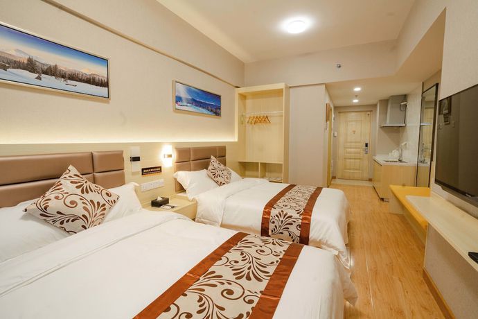 Imagen de la habitación del Hotel Yue Tu Apartment. Foto 14