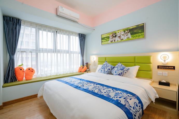 Imagen de la habitación del Hotel Yue Tu Apartment. Foto 16