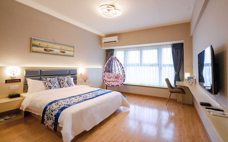Imagen de la habitación del Hotel Yue Tu Apartment. Foto 17