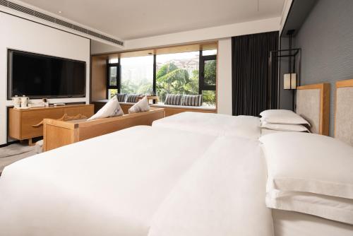 Imagen de la habitación del Hotel Yue Xin Yuan Spa Resort. Foto 17