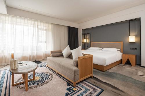 Imagen de la habitación del Hotel Yue Xin Yuan Spa Resort. Foto 18