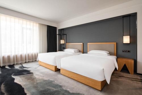 Imagen general del Hotel Yue Xin Yuan Spa Resort. Foto 13