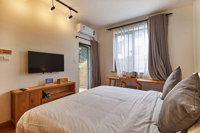 Imagen de la habitación del Hotel Yueshang Yunshe Boutique. Foto 4