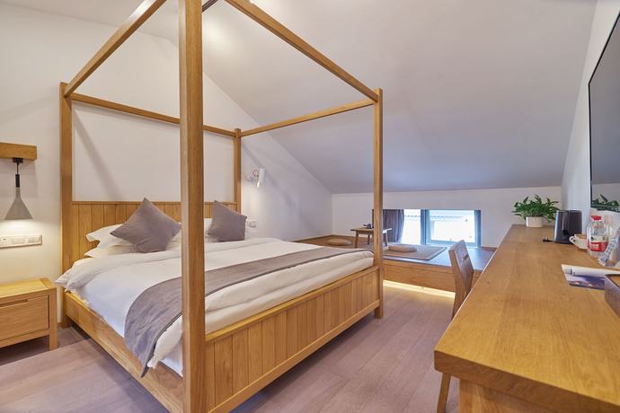 Imagen de la habitación del Hotel Yueshang Yunshe Boutique. Foto 6