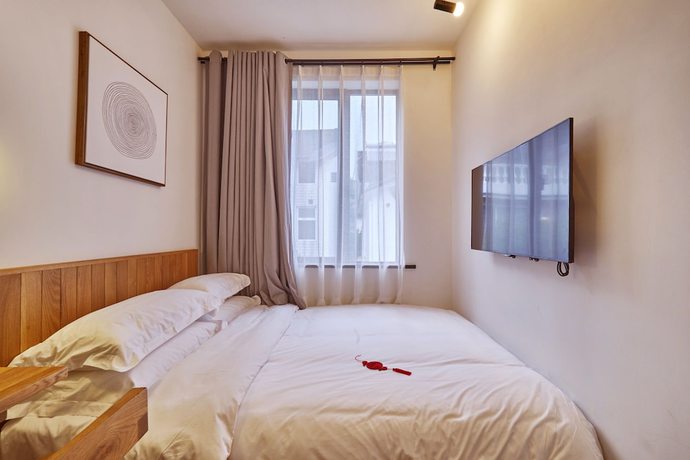 Imagen de la habitación del Hotel Yueshang Yunshe Boutique. Foto 12