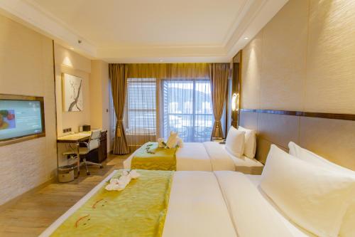 Imagen de la habitación del Hotel Yuexin Tomorrow Sanya. Foto 2