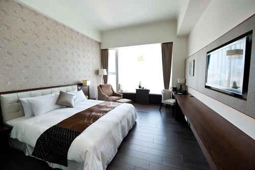 Imagen de la habitación del Hotel Yuh Tong. Foto 6