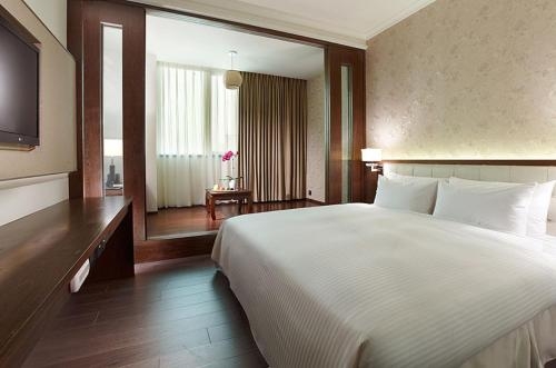 Imagen de la habitación del Hotel Yuh Tong. Foto 7