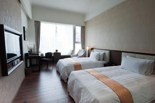 Imagen de la habitación del Hotel Yuh Tong. Foto 9
