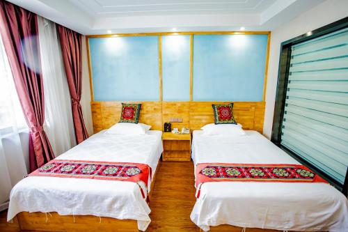 Imagen de la habitación del Hotel Yulin Wanxiang. Foto 18