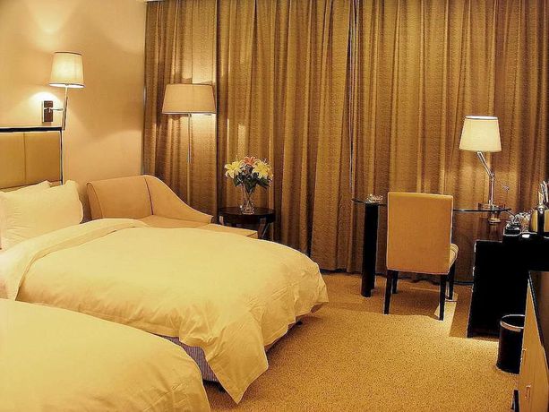 Imagen de la habitación del Hotel Yulong International. Foto 5