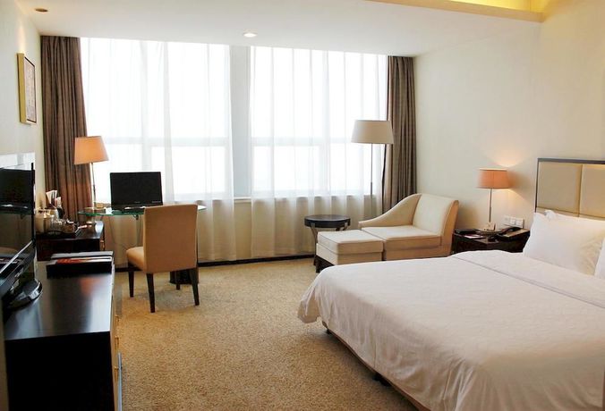 Imagen de la habitación del Hotel Yulong International. Foto 7