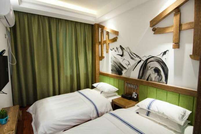 Imagen de la habitación del Hotel Yun Meng Qi Inn. Foto 12