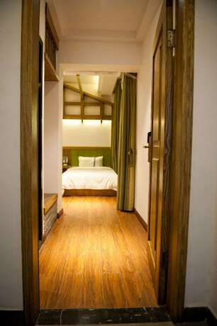 Imagen de la habitación del Hotel Yun Meng Qi Inn. Foto 13