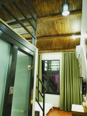 Imagen de la habitación del Hotel Yun Meng Qi Inn. Foto 15