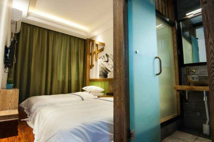Imagen de la habitación del Hotel Yun Meng Qi Inn. Foto 16