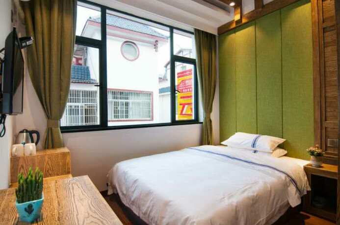 Imagen de la habitación del Hotel Yun Meng Qi Inn. Foto 17
