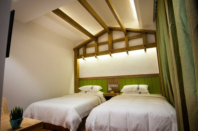 Imagen de la habitación del Hotel Yun Meng Qi Inn. Foto 19