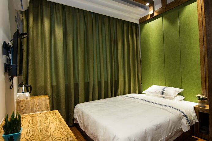 Imagen de la habitación del Hotel Yun Meng Qi Inn. Foto 20