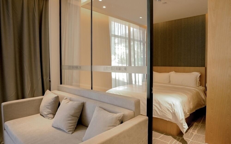 Imagen de la habitación del Hotel YunDing Grand Hotel South Apartment. Foto 3