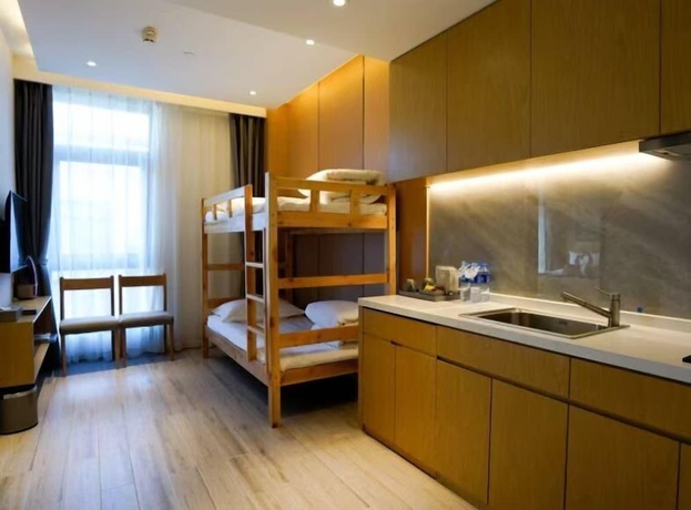 Imagen de la habitación del Hotel YunDing Grand Hotel South Apartment. Foto 9