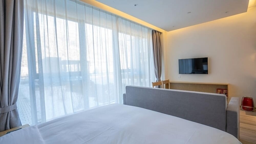 Imagen de la habitación del Hotel YunDing Grand Hotel South Apartment. Foto 12