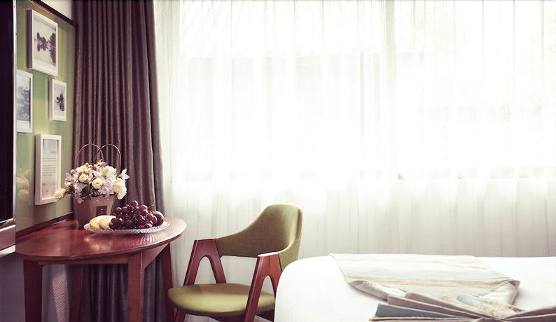 Imagen de la habitación del Hotel Yurong West Lake Cottage Resort. Foto 9