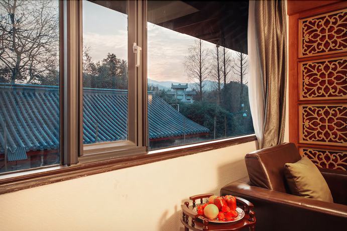 Imagen de la habitación del Hotel Yurong West Lake Cottage Resort. Foto 12
