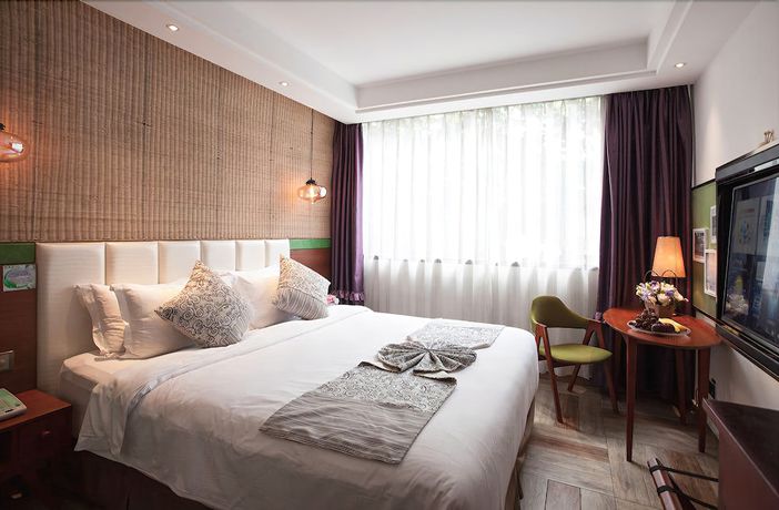 Imagen de la habitación del Hotel Yurong West Lake Cottage Resort. Foto 15
