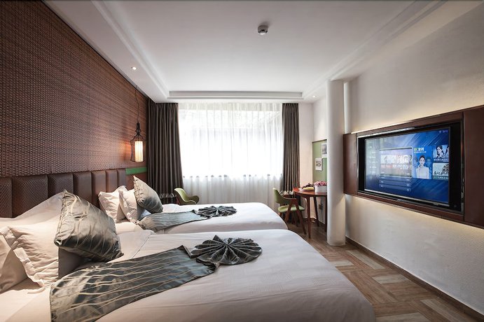 Imagen de la habitación del Hotel Yurong West Lake Cottage Resort. Foto 17