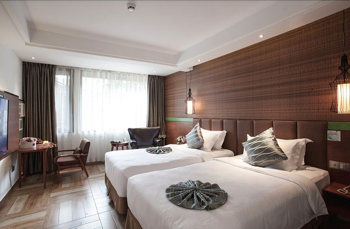 Imagen de la habitación del Hotel Yurong West Lake Cottage Resort. Foto 18