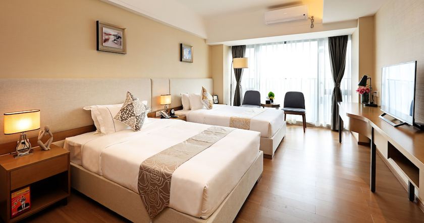 Imagen de la habitación del Hotel Yuwa Serviced. Foto 4