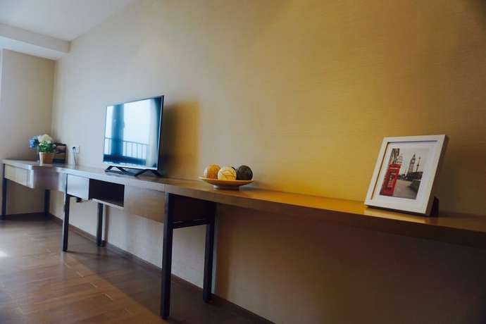 Imagen de la habitación del Hotel Yuwa Serviced. Foto 7