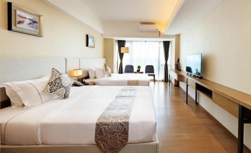 Imagen de la habitación del Hotel Yuwa Serviced Residence. Foto 6