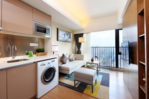 Imagen de la habitación del Hotel Yuwa Serviced Residence. Foto 7