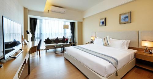Imagen de la habitación del Hotel Yuwa Serviced Residence. Foto 8