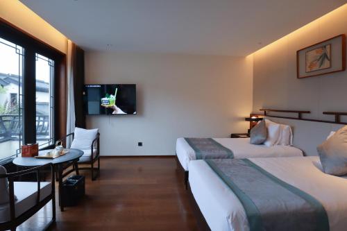 Imagen de la habitación del Hotel Yuyao Yangmingguan. Foto 11