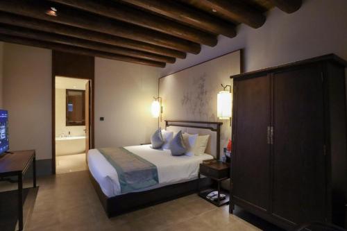 Imagen de la habitación del Hotel Yuyao Yangmingguan. Foto 14